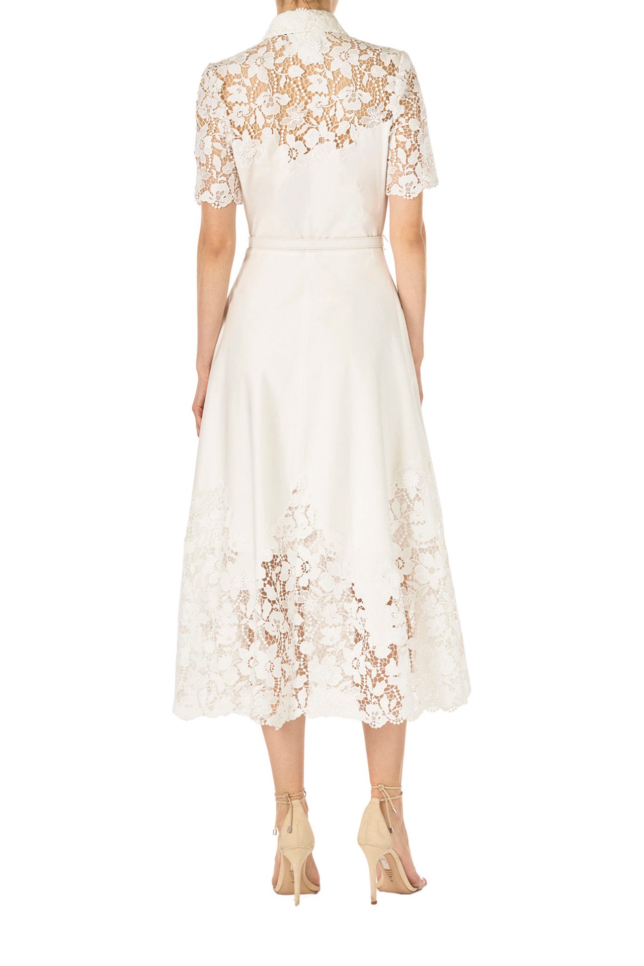 Monique Lhuillier Spring 2025 white cotton poplin dress with lace applique inserts, short sleeves, button down front bodice and belted waist - back.