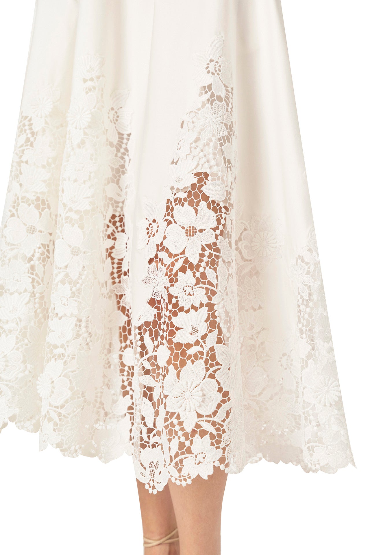 Monique Lhuillier Spring 2025 white cotton poplin dress with lace applique inserts, short sleeves, button down front bodice and belted waist - lace hem.
