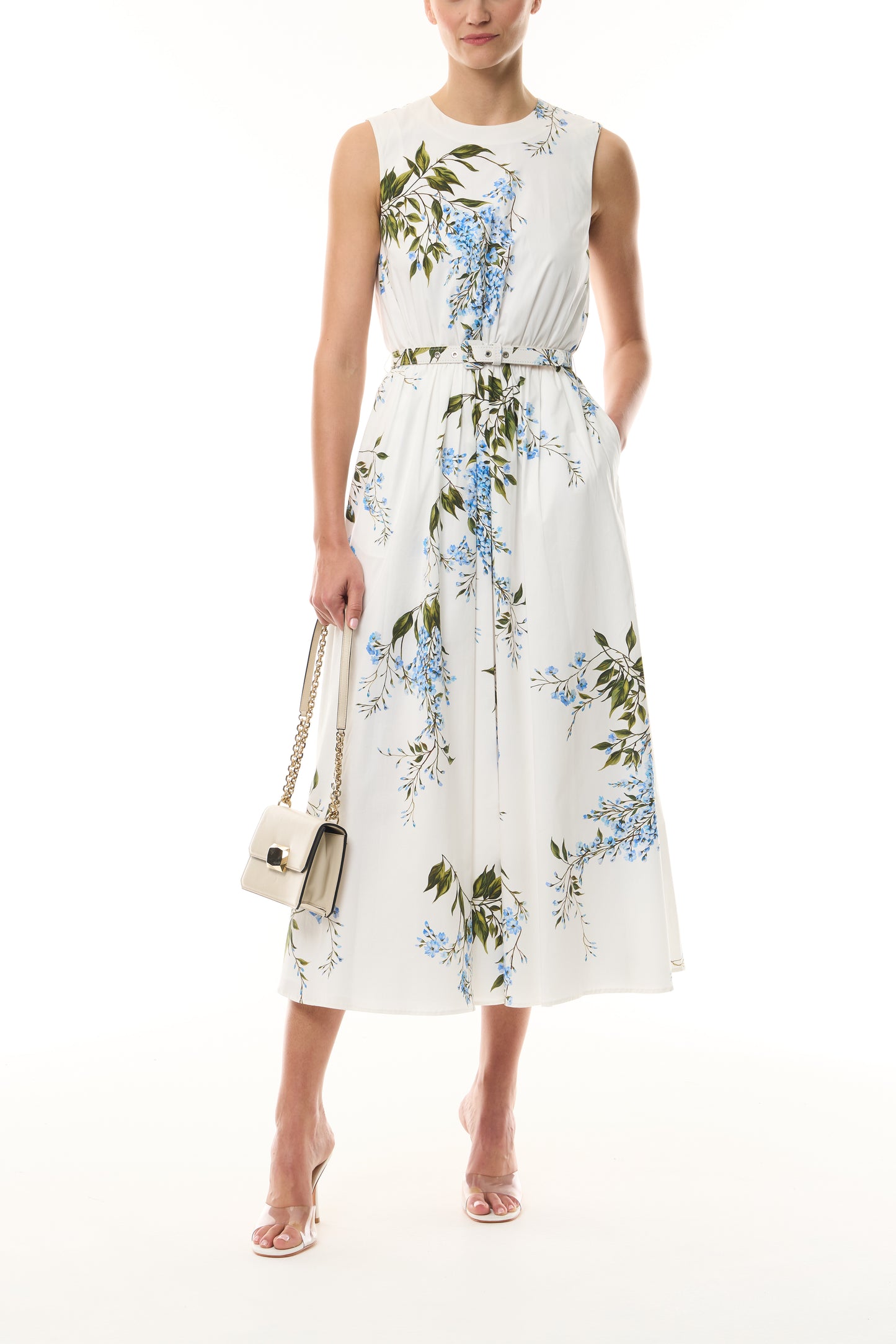 Monique Lhuillier Fall 2026 White/Multi Wisteria Printed Stretch Cotton Poplin day dress with belt and pockets - front with Cream Rhea Mini Shoulder Bag.