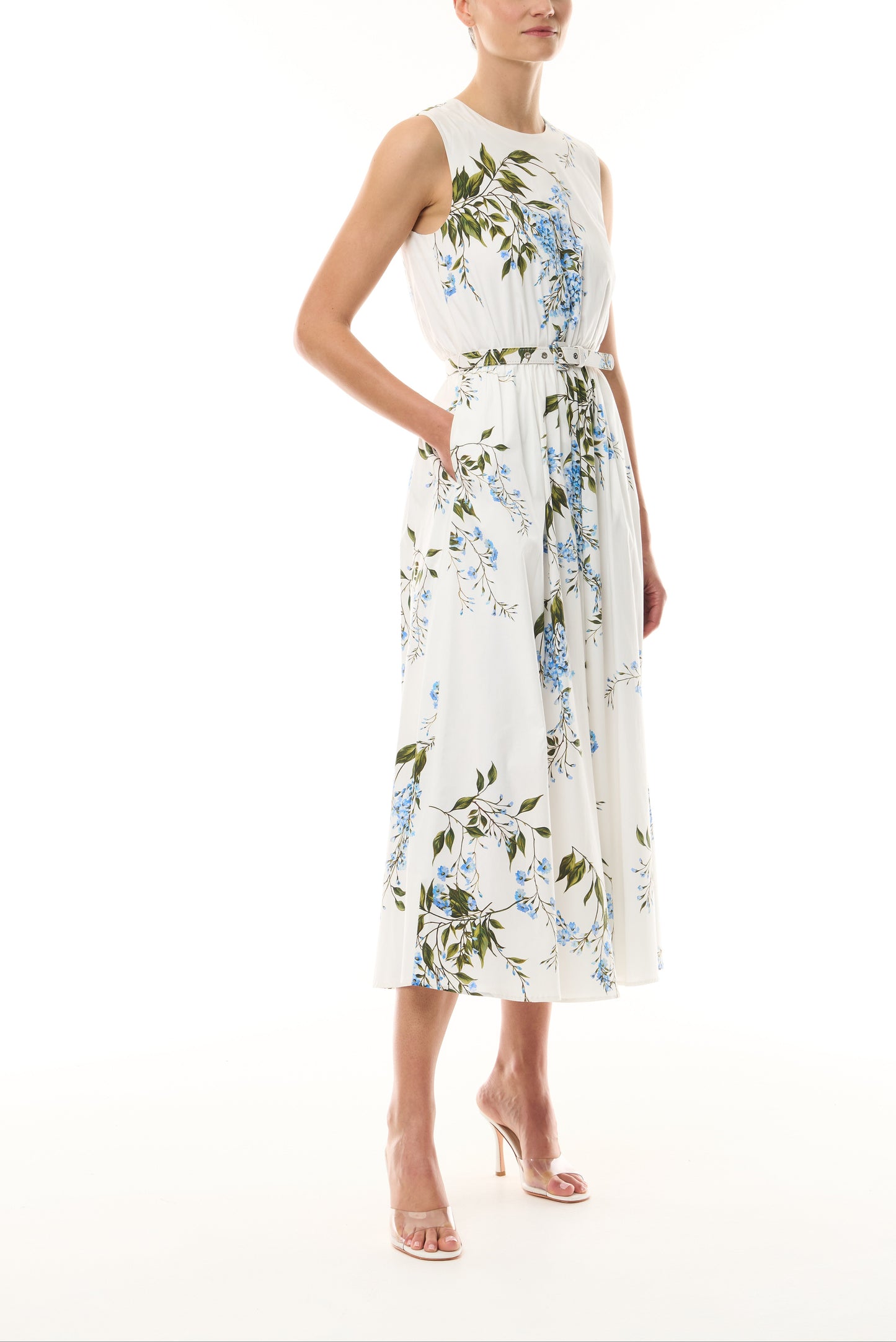 Monique Lhuillier Fall 2026 White/Multi Wisteria Printed Stretch Cotton Poplin day dress with jewel neckline, belt, pockets and a-line skirt - side.