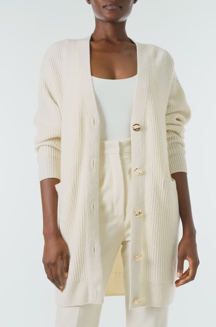 Monique Lhuillier Spring 2024 white cashmere long chunky cardigan with gold buttons - video.