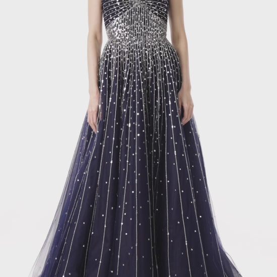 Monique Lhuillier strapless ballgown with sweetheart neckline in midnight tulle and silver embroidery.