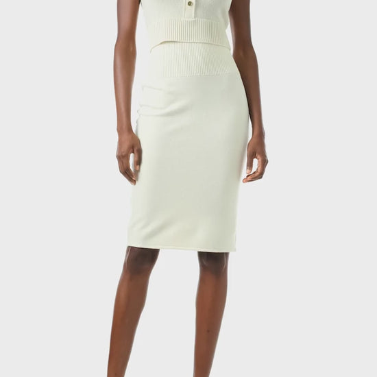 Monique Lhuillier Spring 2024 white cropped cashmere tank with scoop neck and gold button closure - video.