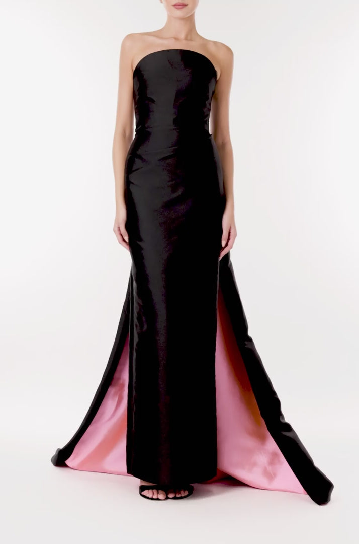 Monique Lhuillier strapless column gown in black silk faille with pink bi-color train.