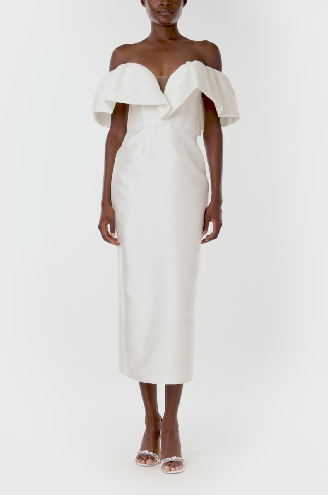 Monique Lhuillier midi length Chantel bridal dress with ruffle neckline and deep v sweetheart neckline in silk white mikado fabric.