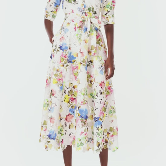 Monique Lhuillier Spring 2024 silk white floral printed lace shirt dress with pockets and a scalloped hem - video.