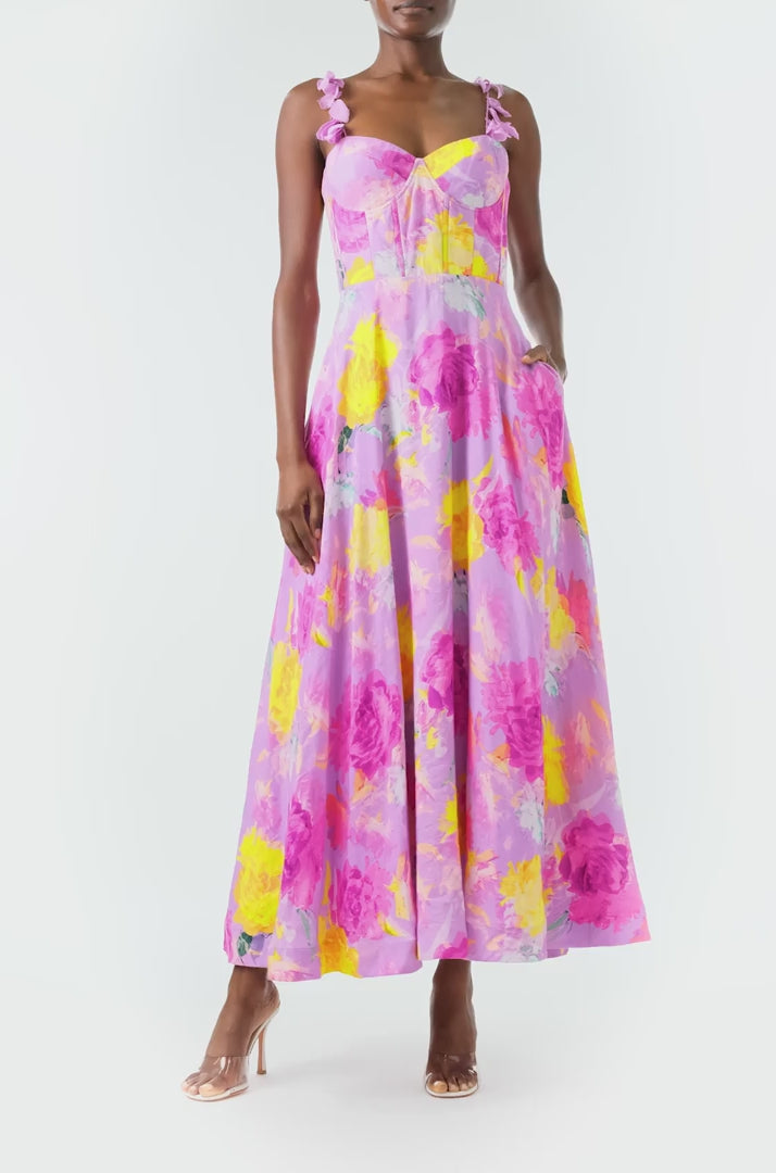 ML Monique Lhuillier 2024 Sleeveless midi dress with floral appliqued spaghetti straps and corset bodice in pink, purple and yellow floral printed linen - video.