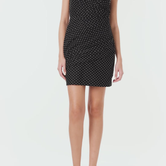 ML Monique Lhuillier black and white dotted tulle mini dress with puff shoulder accents.