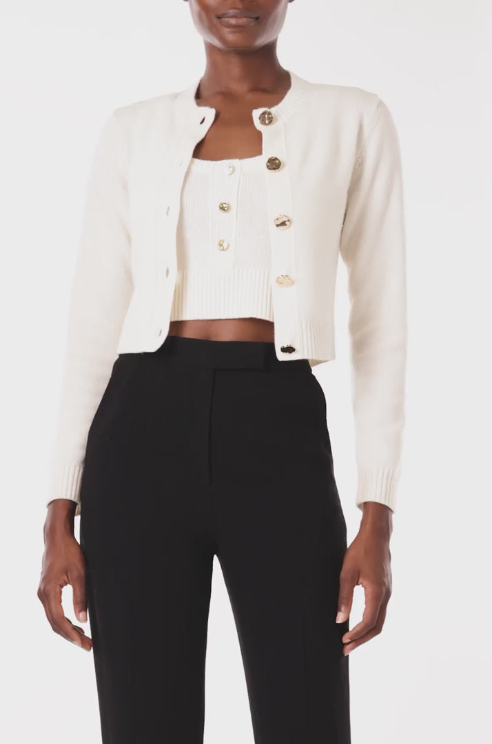 Monique Lhuillier Spring 2024 white knit cropped cardigan - video.