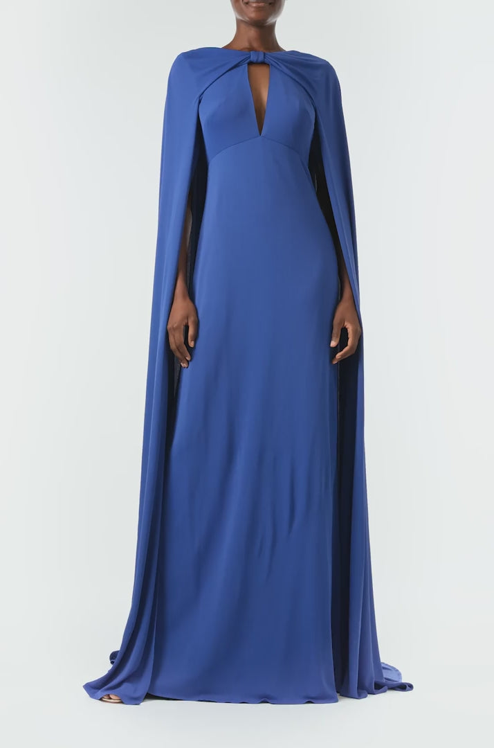 Monique Lhuillier Spring 2024 royal blue crepe-back satin gown with attached cape and keyhole bodice - video.