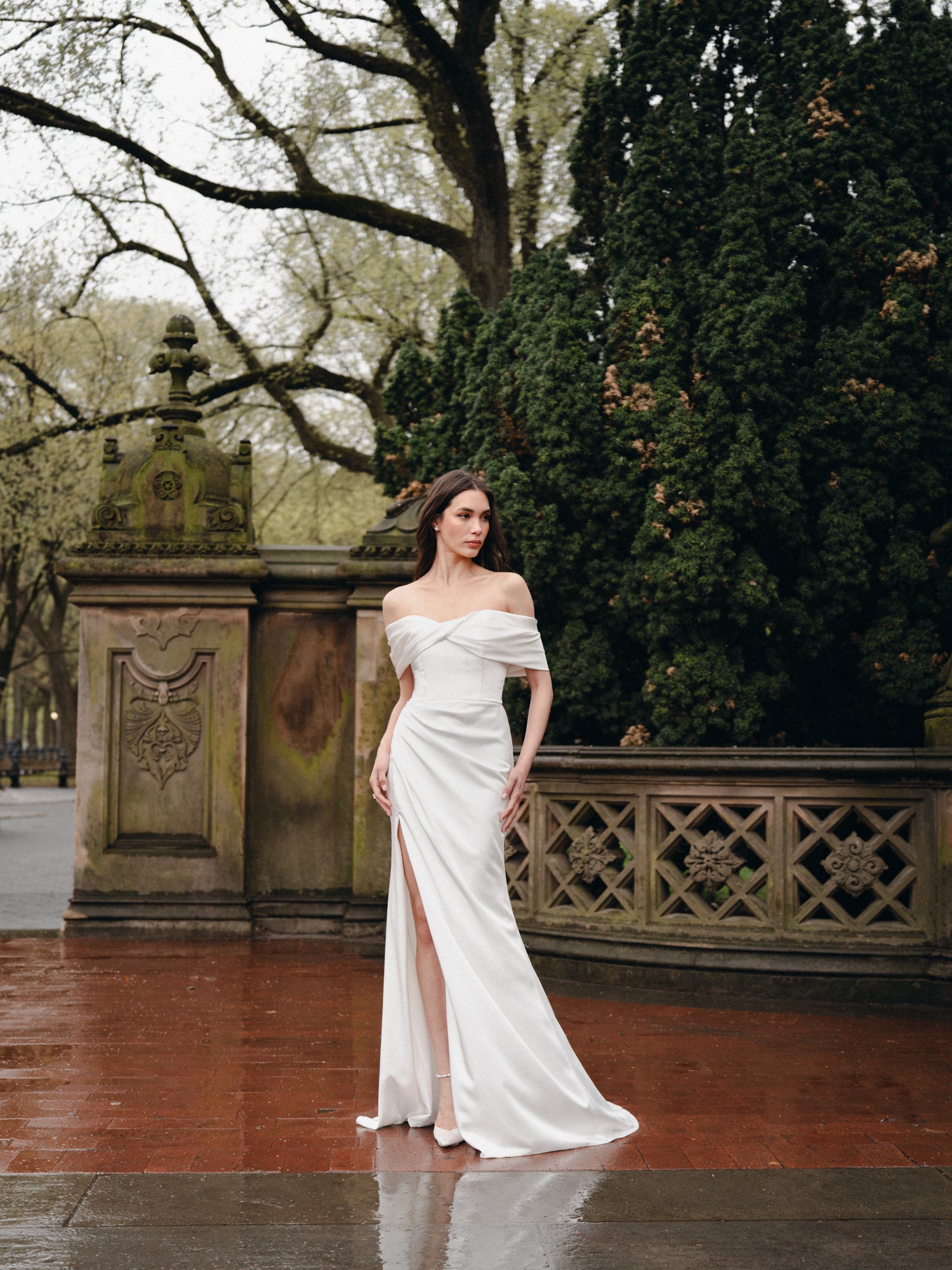 Draped off-the-shoulder gown with slit In Crepe Satin.