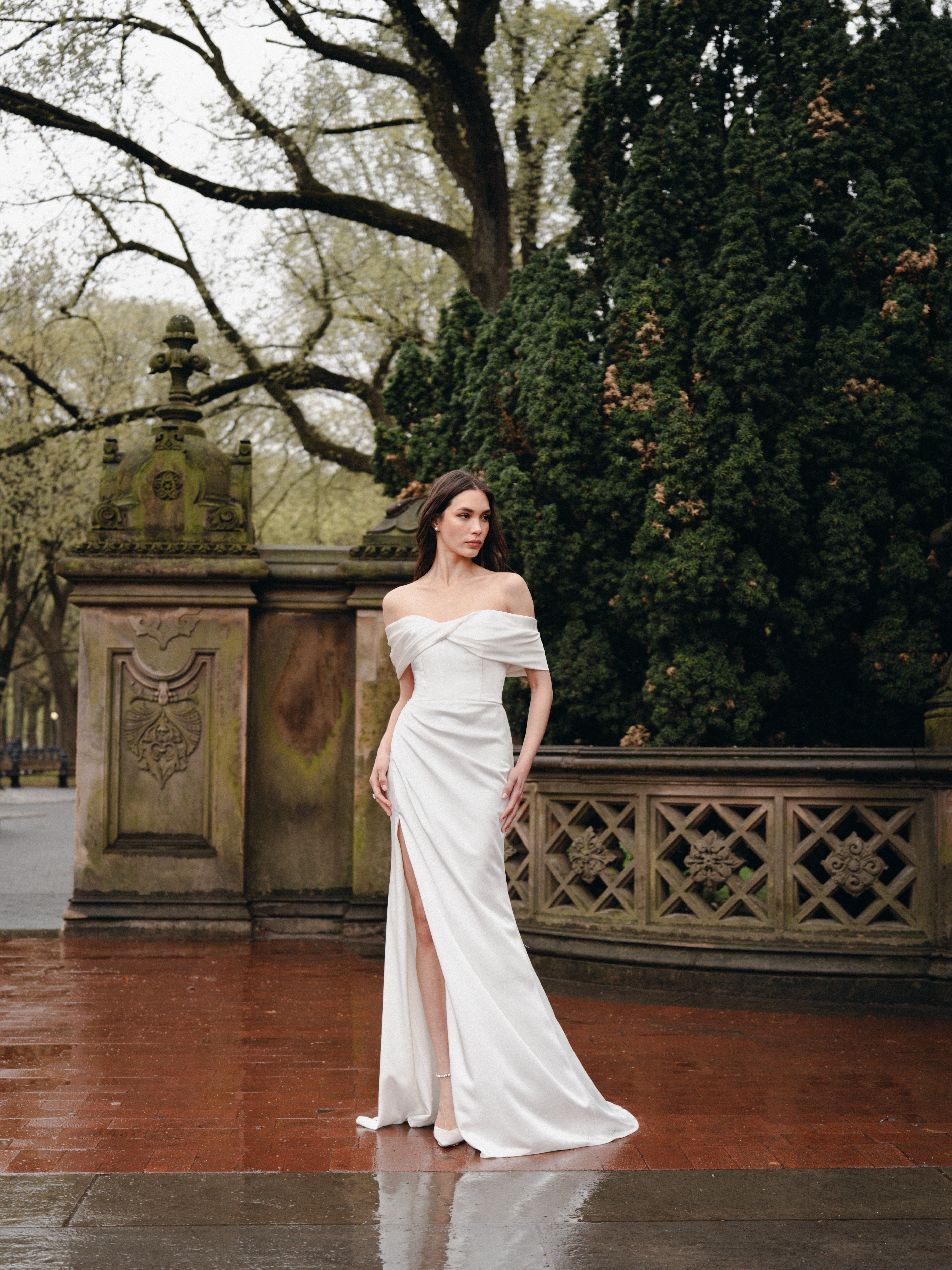 Draped off-the-shoulder gown with slit In Crepe Satin.