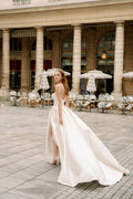Woman wearing Monique Lhuillier Spring 2024 Bliss white strapless mikado BL24101 ballgown