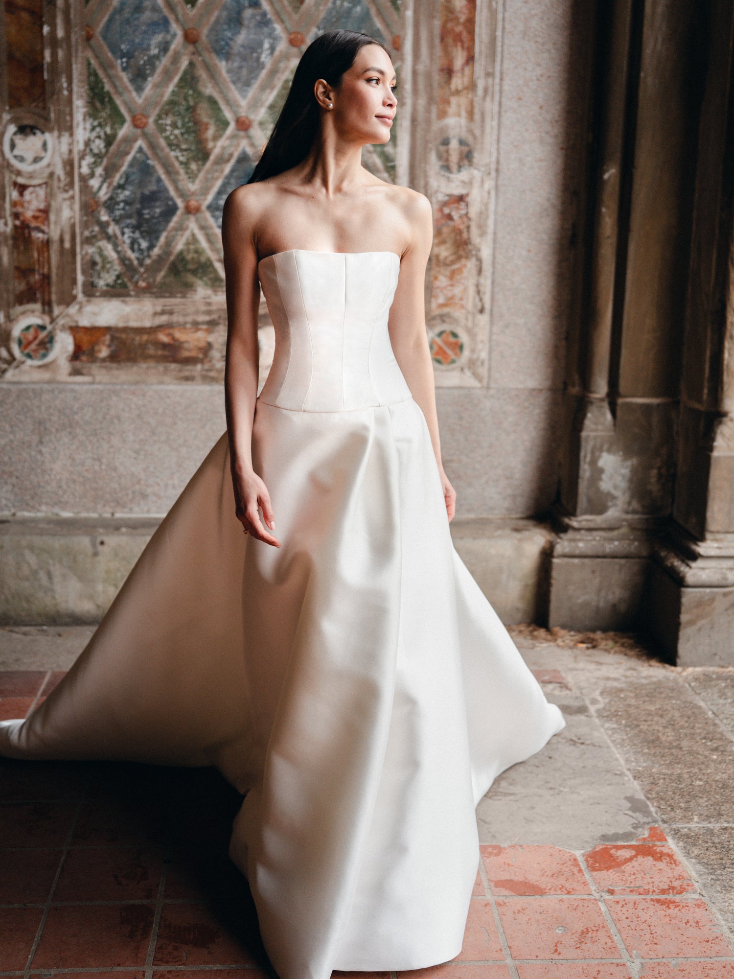 Strapless Mikado ballgown with drop waist and slit.