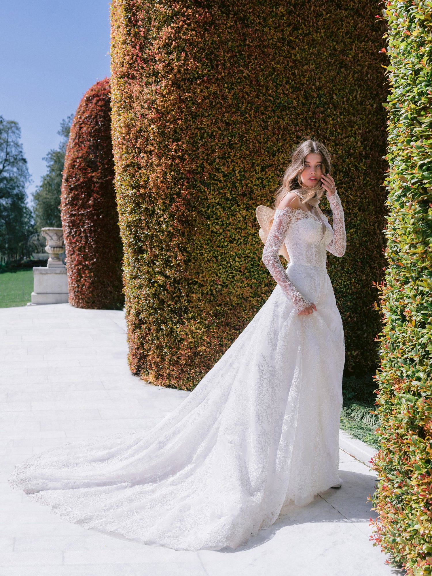 Monique Lhuillier Spring 2024 Lawrence lace bridal gown and jacket.