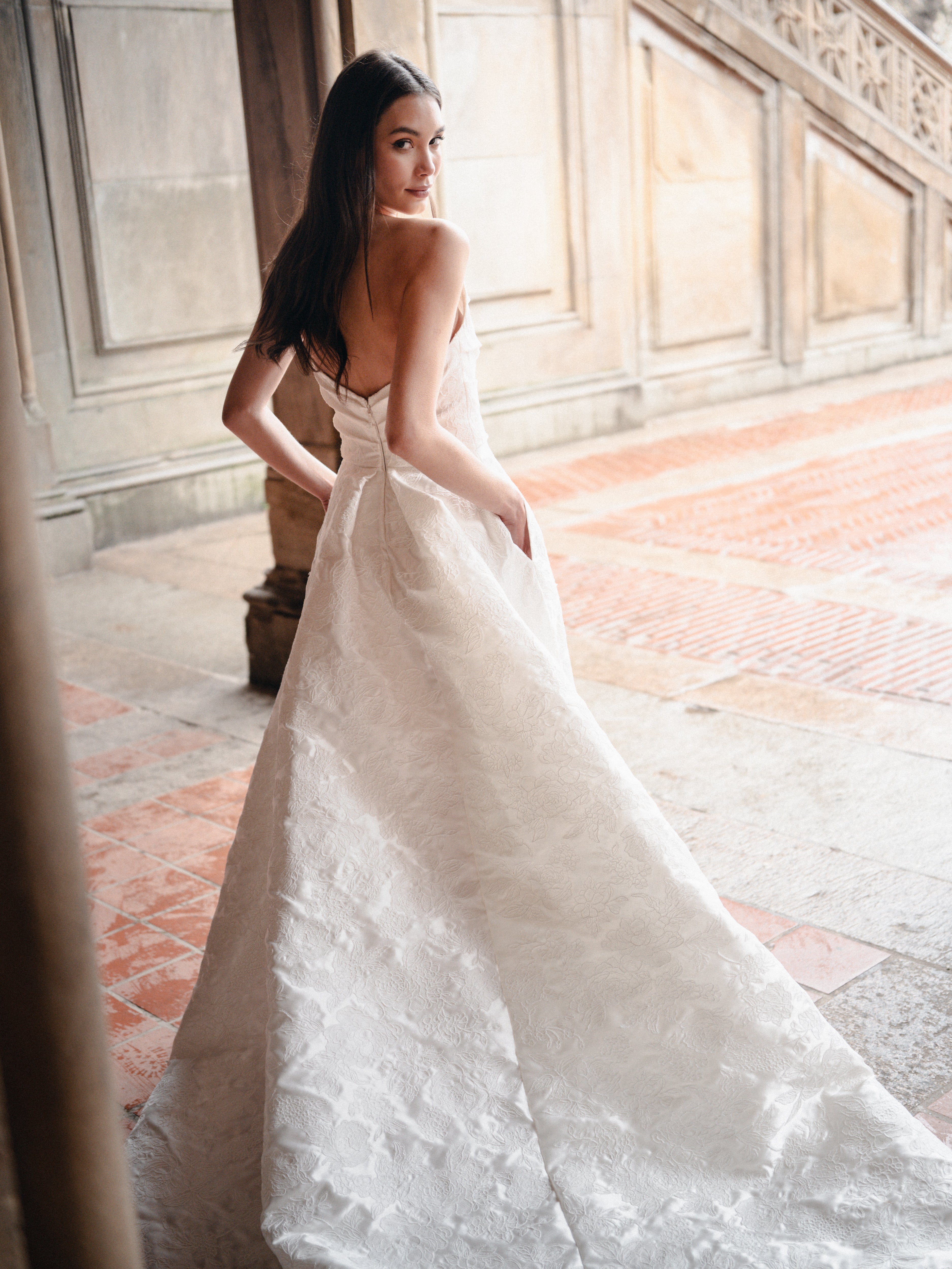 Draped ballgown with skirt slit In Corded Lace Mikado.