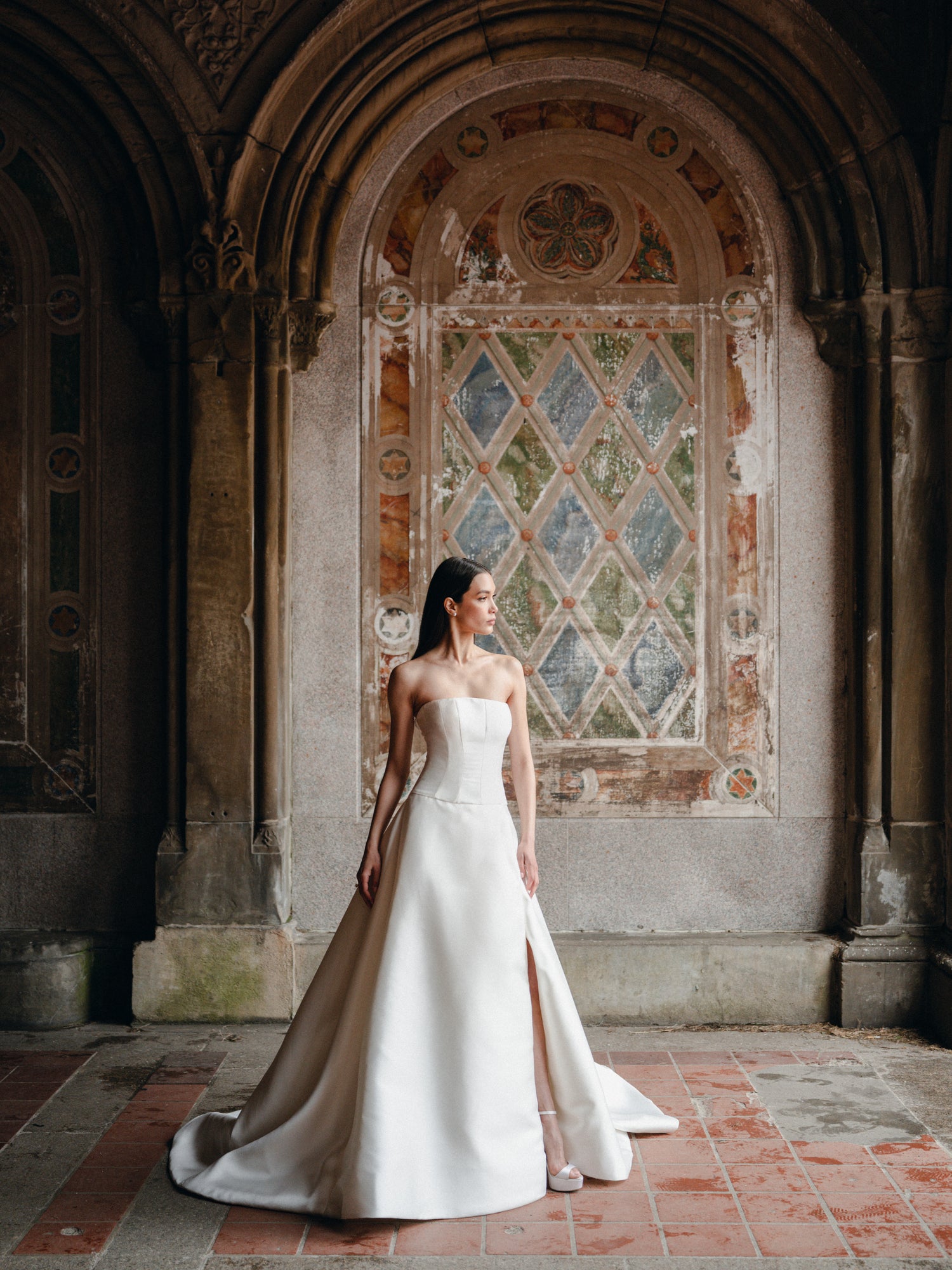 Strapless Mikado ballgown with drop waist and slit.