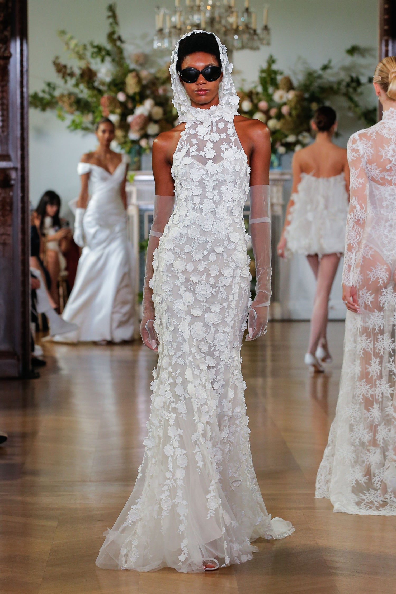 Monique Lhuillier Fall 2026 Bridal silk white/pearl embroidered lace halter Giselle sheath gown with three-dimensional floral embroidery - runway.