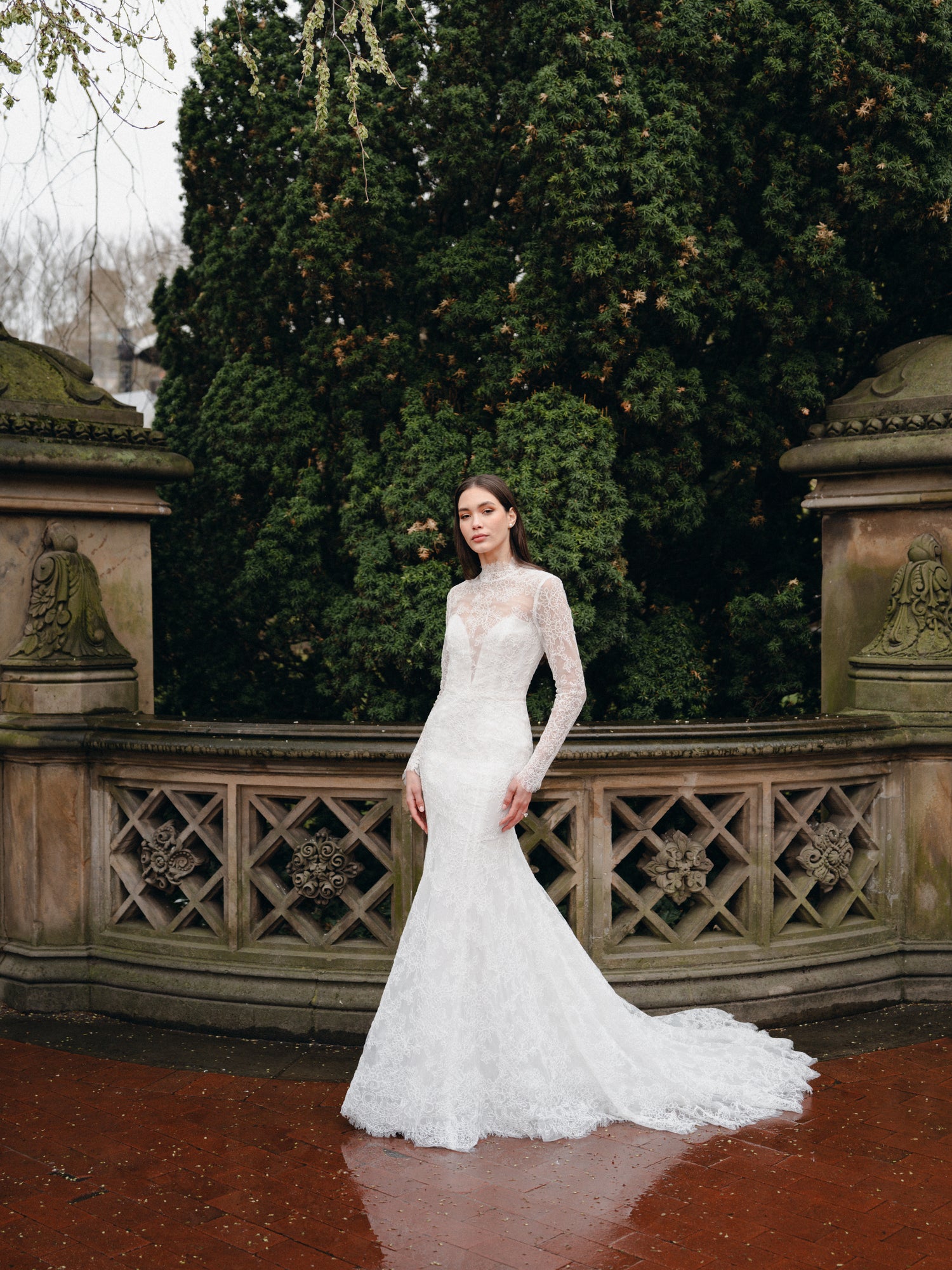 High neck lace trumpet gown with long sleeves and keyhole back.