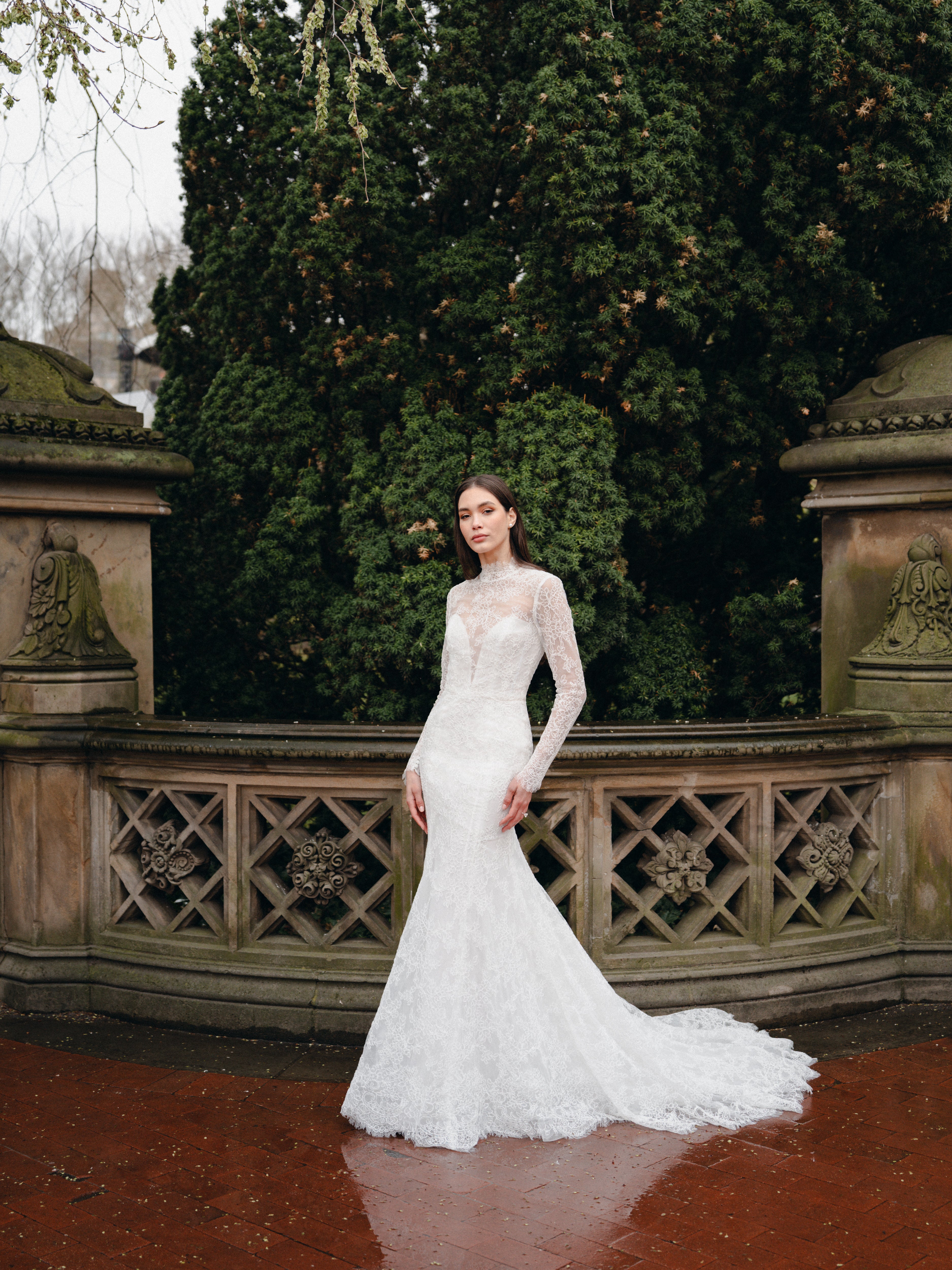 High neck lace trumpet gown with long sleeves and keyhole back.