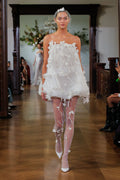 Monique Lhuillier Fall 2026 Bridal silk white organza bubble hem Poppy cocktail dress with three dimensional floral embroidery and feather detail - runway.