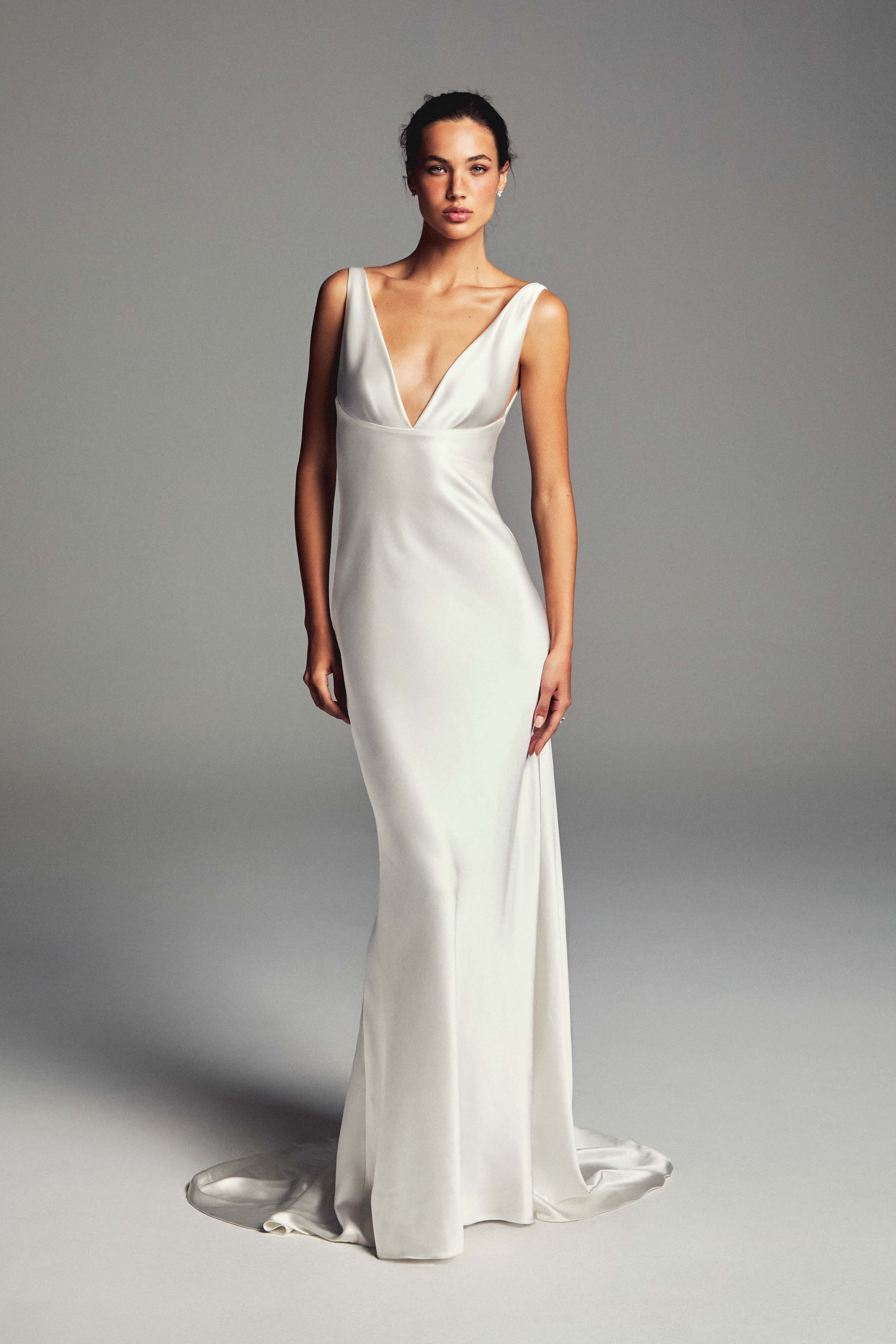 Monique Lhuillier Spring 2027 Bridal V-neck Tribeca sheath gown in silk white crepe back satin.