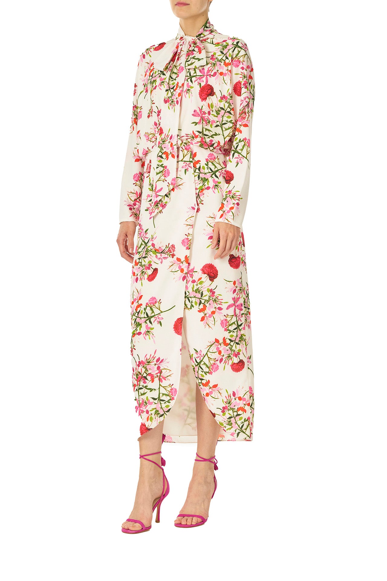 Monique Lhuillier Long sleeve dress with tie neck and faux-wrap skirt in Silk White Fuchsia floral print - left side.