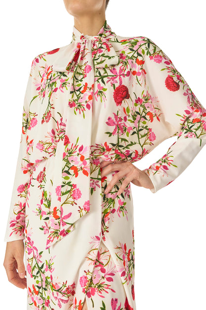 Monique Lhuillier Long sleeve dress with tie neck and faux-wrap skirt in Silk White Fuchsia floral print - fabric detail.