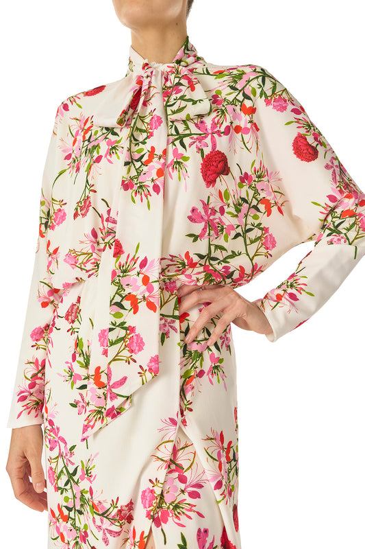 Monique Lhuillier Long sleeve dress with tie neck and faux-wrap skirt in Silk White Fuchsia floral print - fabric detail.