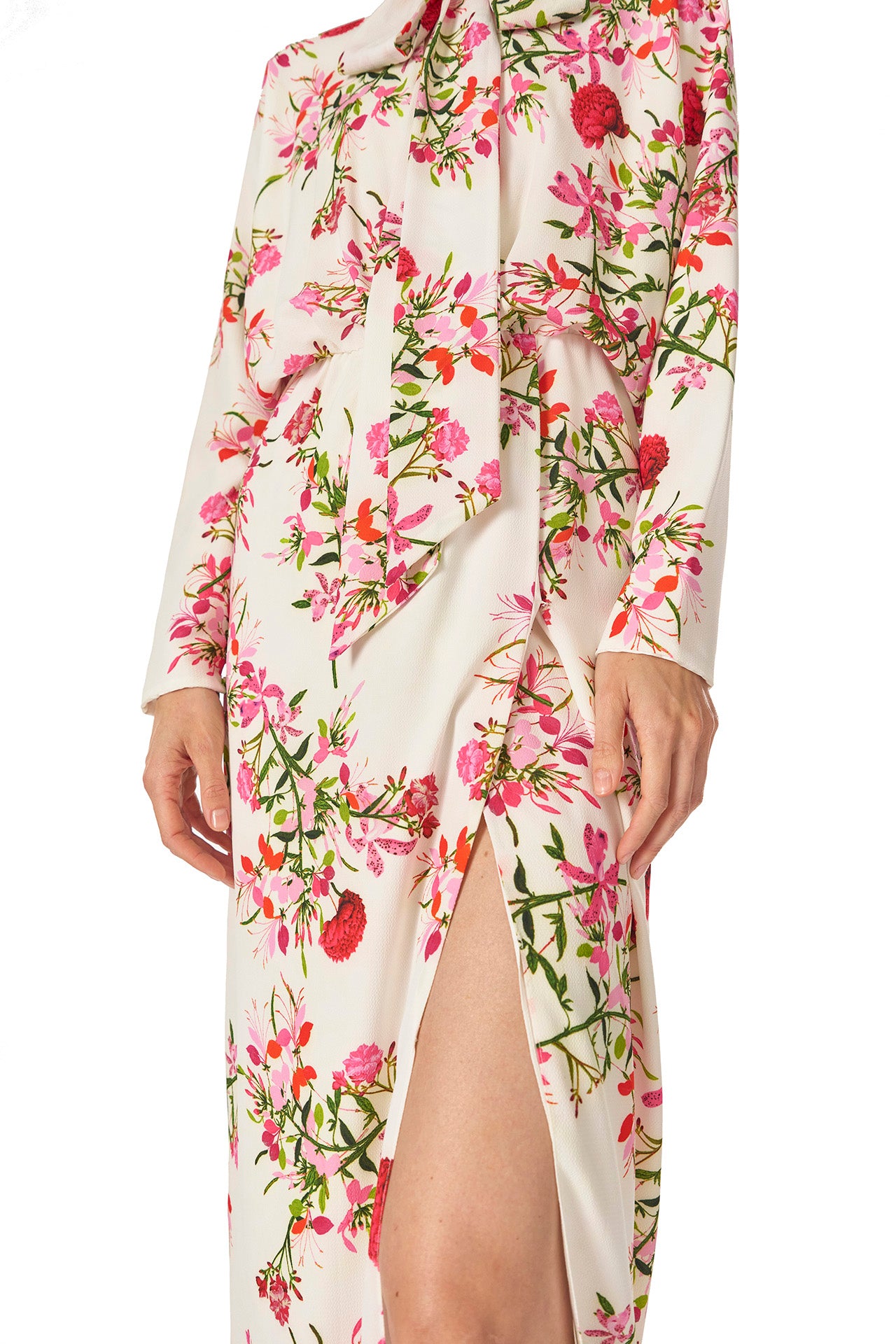 Monique Lhuillier Long sleeve dress with tie neck and faux-wrap skirt in Silk White Fuchsia floral print - leg slit.