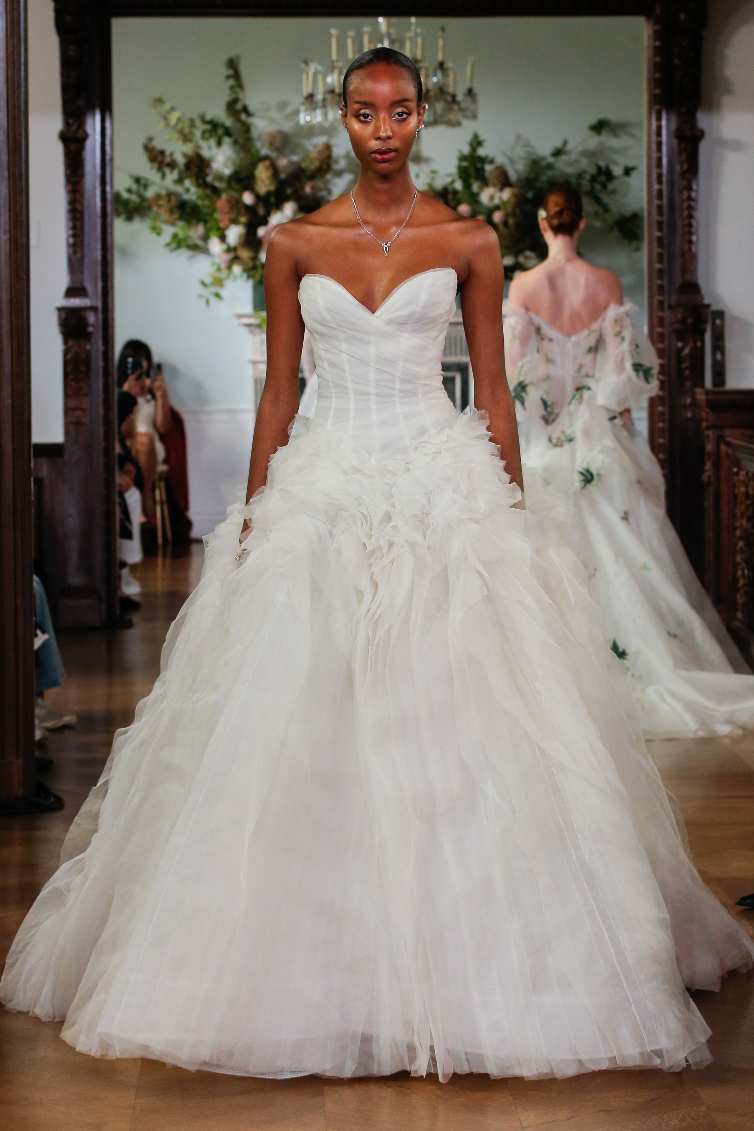 Monique Lhuillier Fall 2026 Bridal ivory silk organza and gazar strapless drop waist
draped Phoenix ballgown with bias cut textured skirt - runway.