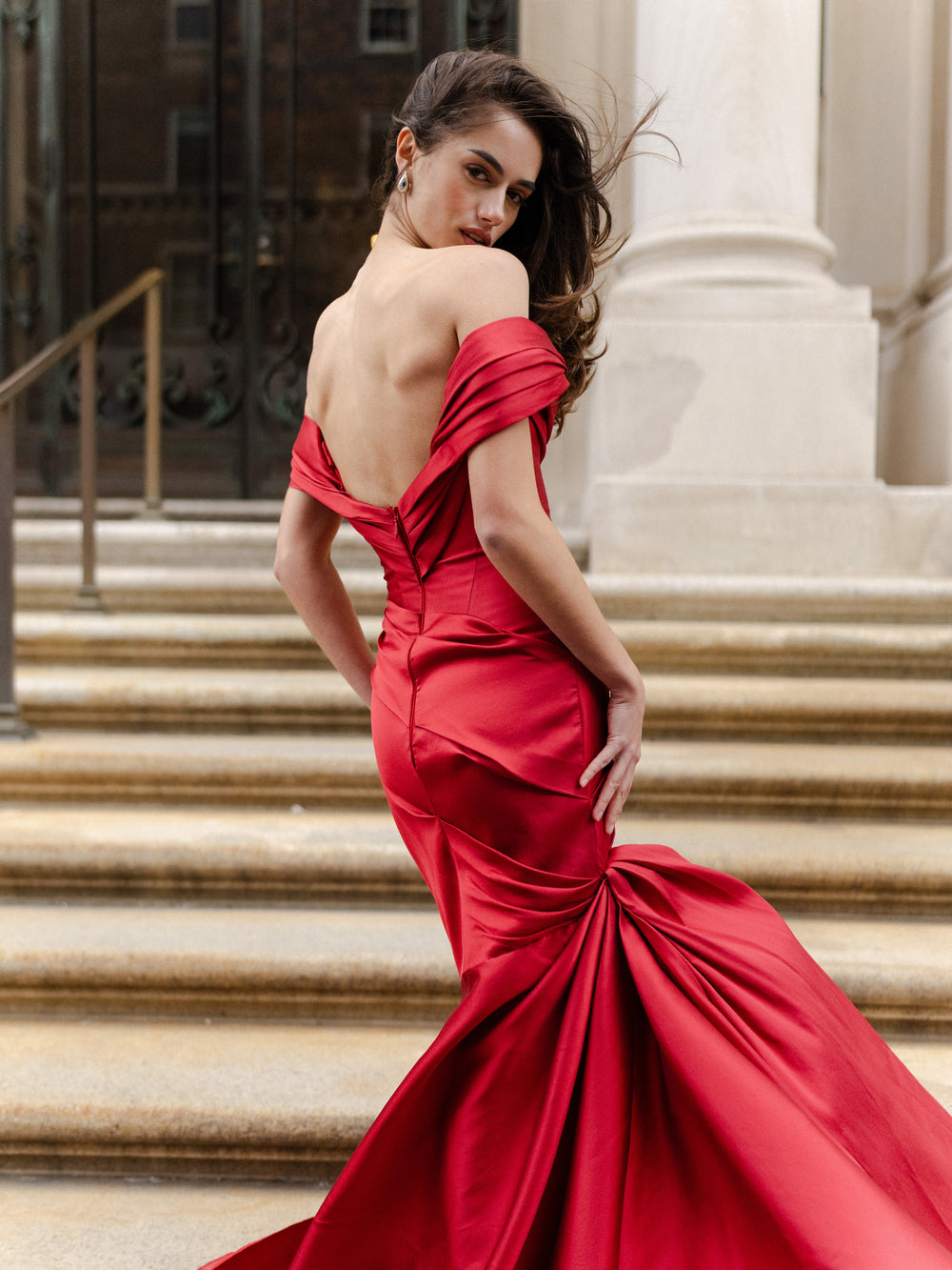 Monique Lhuillier Fall 2024 scarlet mikado, off-the-shoulder, draped gown with trumpet skirt and low back - lookbook back.