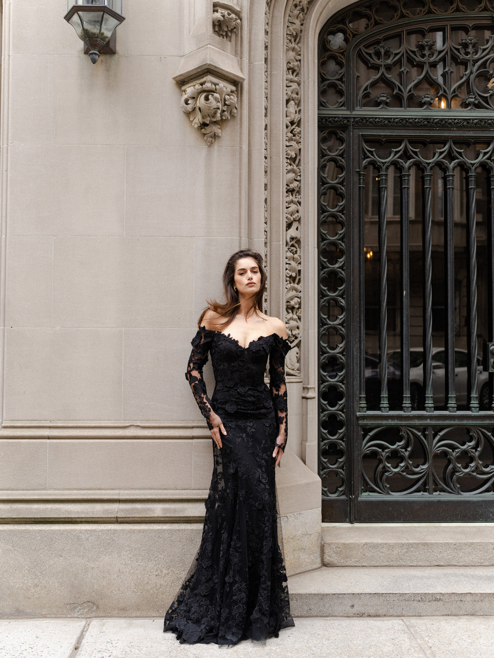 Monique Lhuillier Fall 2024 Long sleeve black lace trumpet gown with off-the-shoulder sweetheart neckline and unlined sleeves - lookbook two.