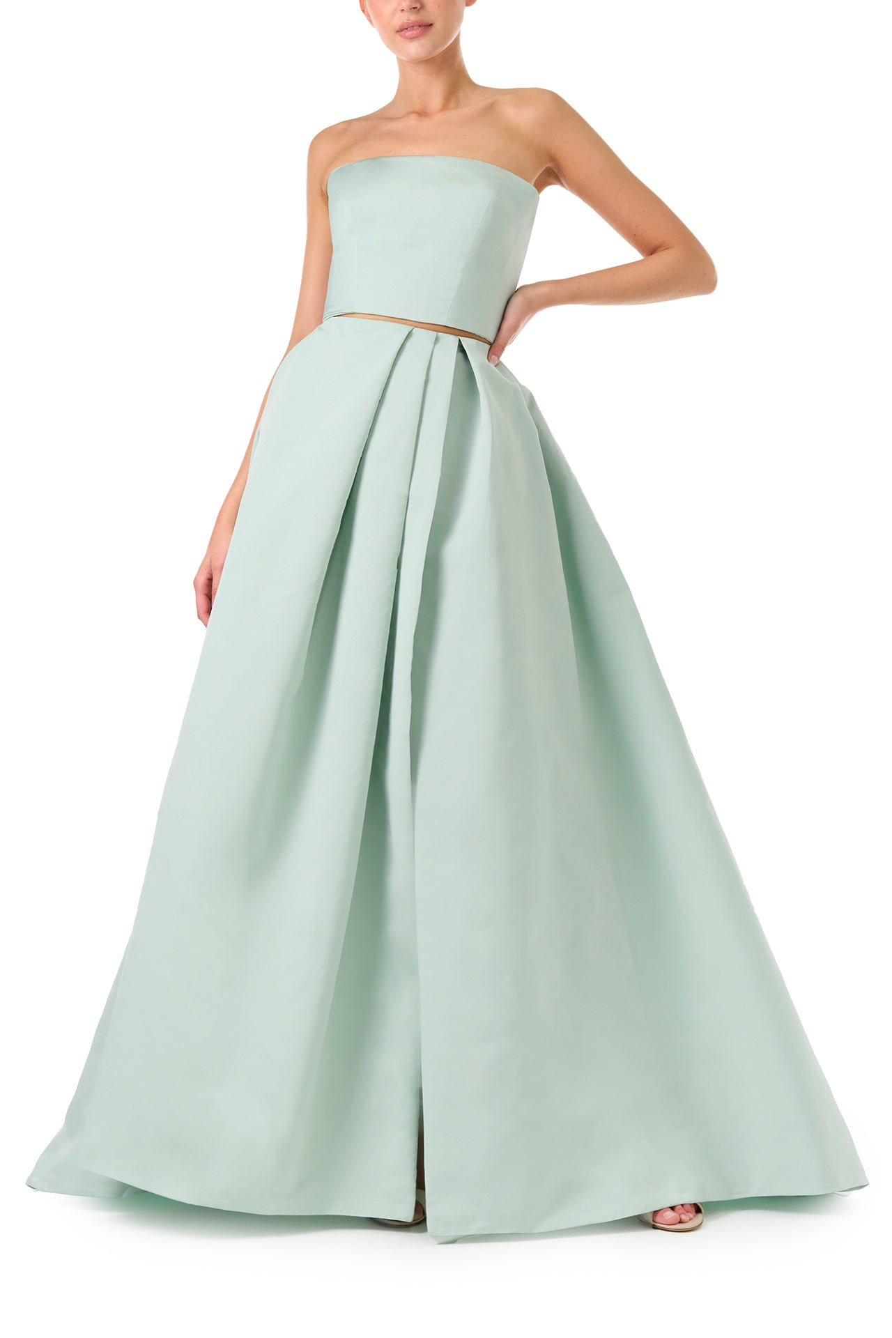 Monique Lhuillier Spring 2023 ball skirt with front slit in pistachio silk faille fabric - front.