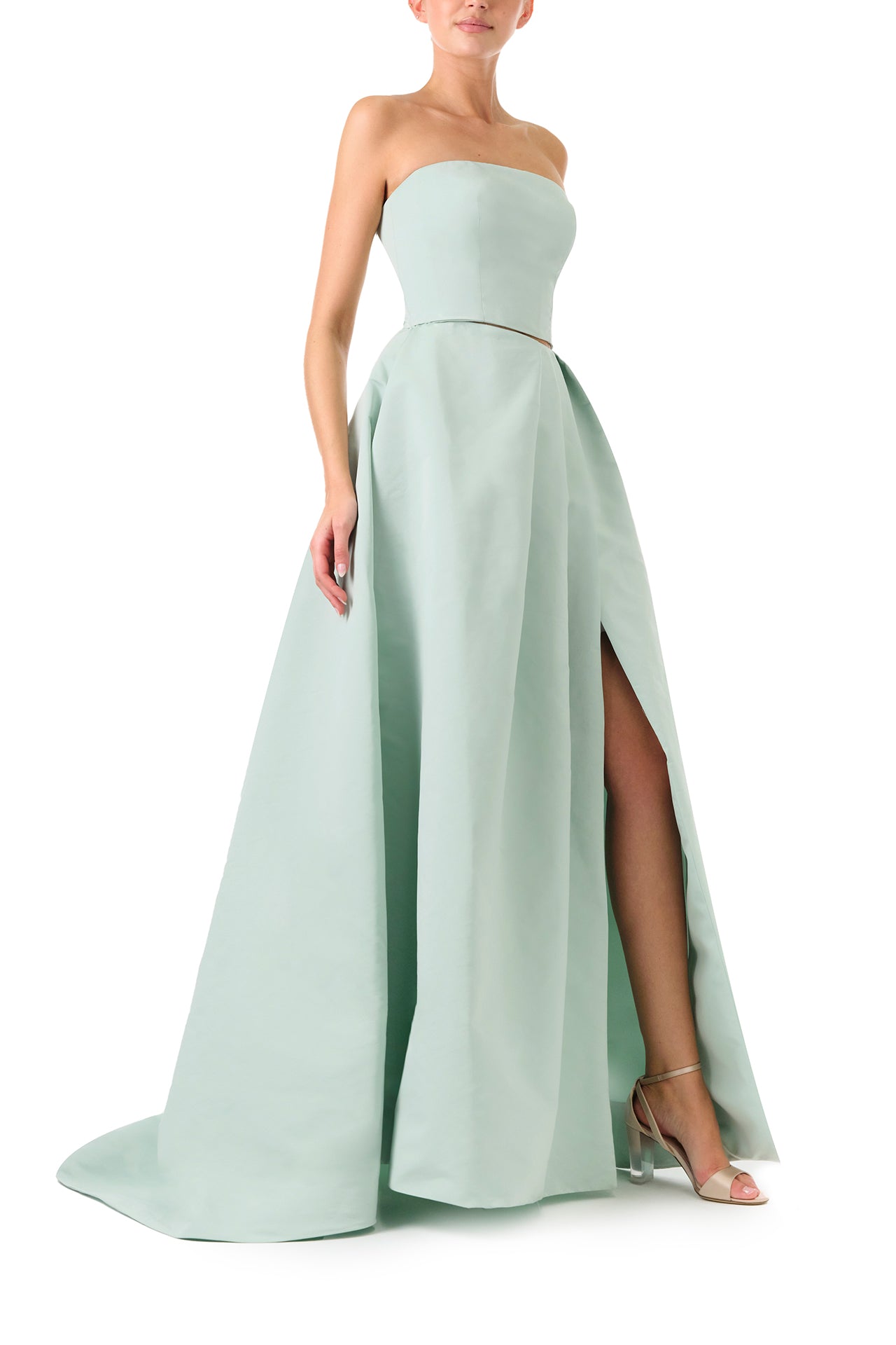 Monique Lhuillier Spring 2023 ball skirt with front slit in pistachio silk faille fabric - right side.