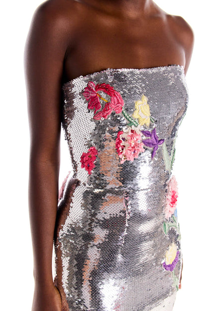 Monique Lhuillier strapless silver sequin column gown with floral embroidery.