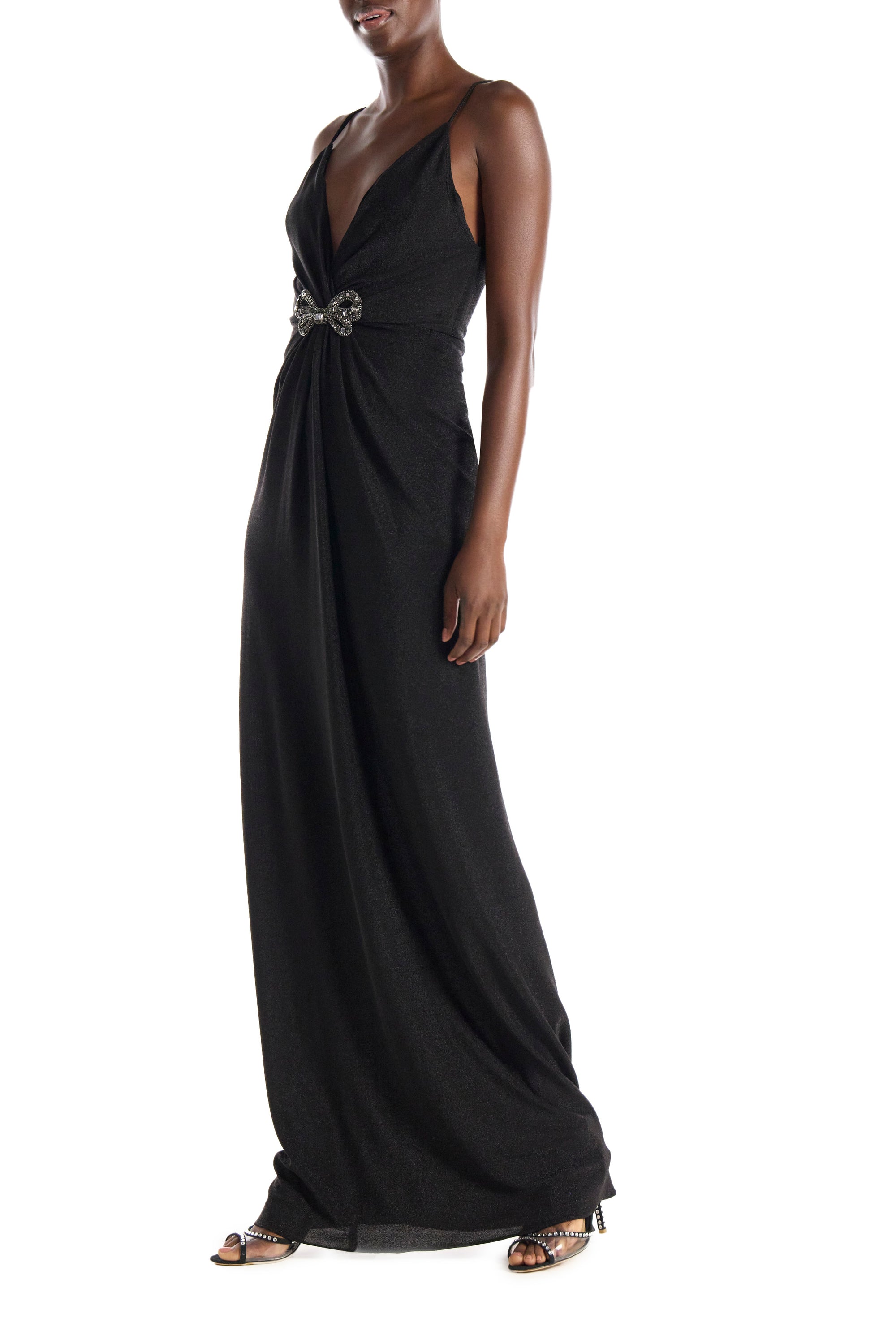 Monique Lhuillier black glitter knit gown with deep v neck, spaghetti straps and embroidered bow detail at bodice.