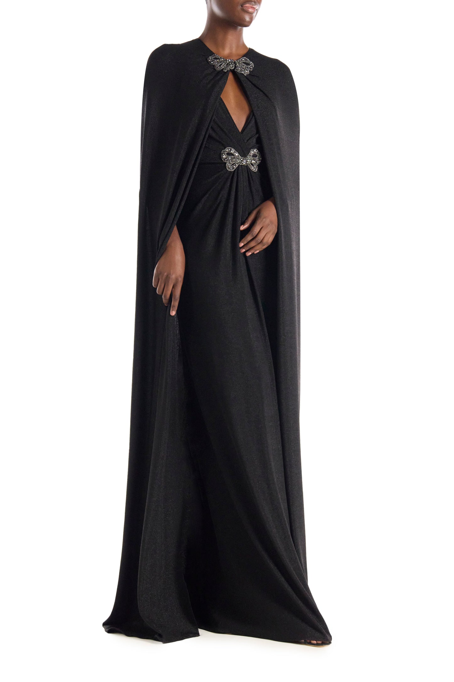 Monique Lhuillier black glitter knit evening cape with embroidered bow closure at neckline.
