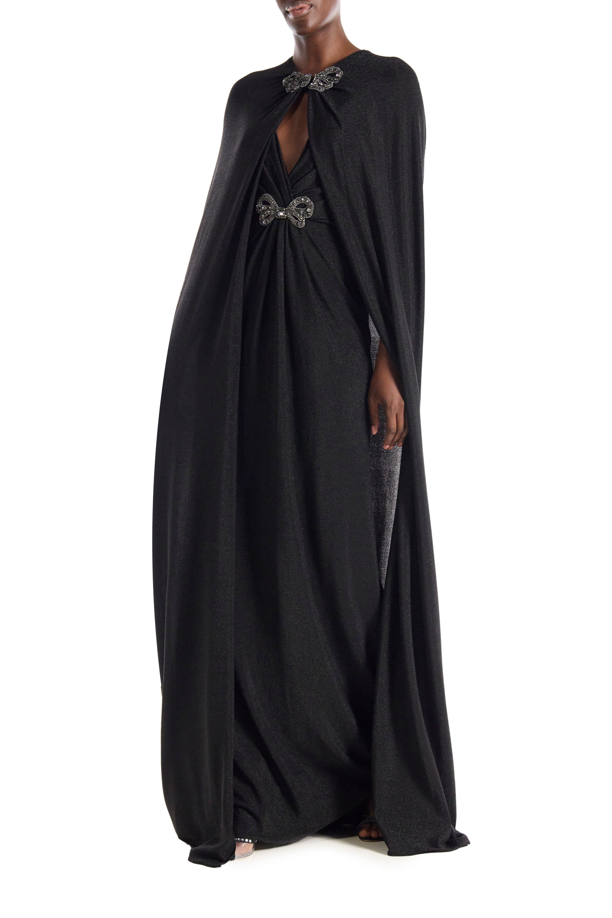 Monique Lhuillier black glitter knit evening cape with embroidered bow closure at neckline.