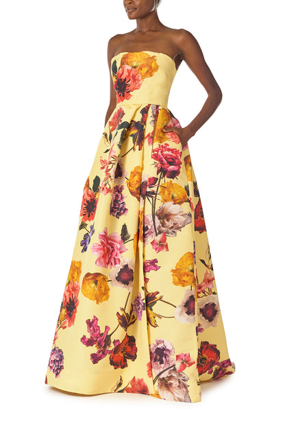 Monique Lhuillier Fall 2024 strapless ball gown with pleated waist and high side slit in soleil floral fabric - side with pocket.