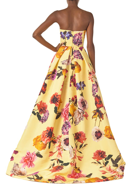 Monique Lhuillier Fall 2024 strapless ball gown with pleated waist and high side slit in soleil floral fabric - back.