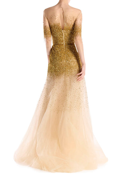 Monique Lhuillier illusion neckline and sheer 3/4 sleeve ballgown with cascading gold embroidery.