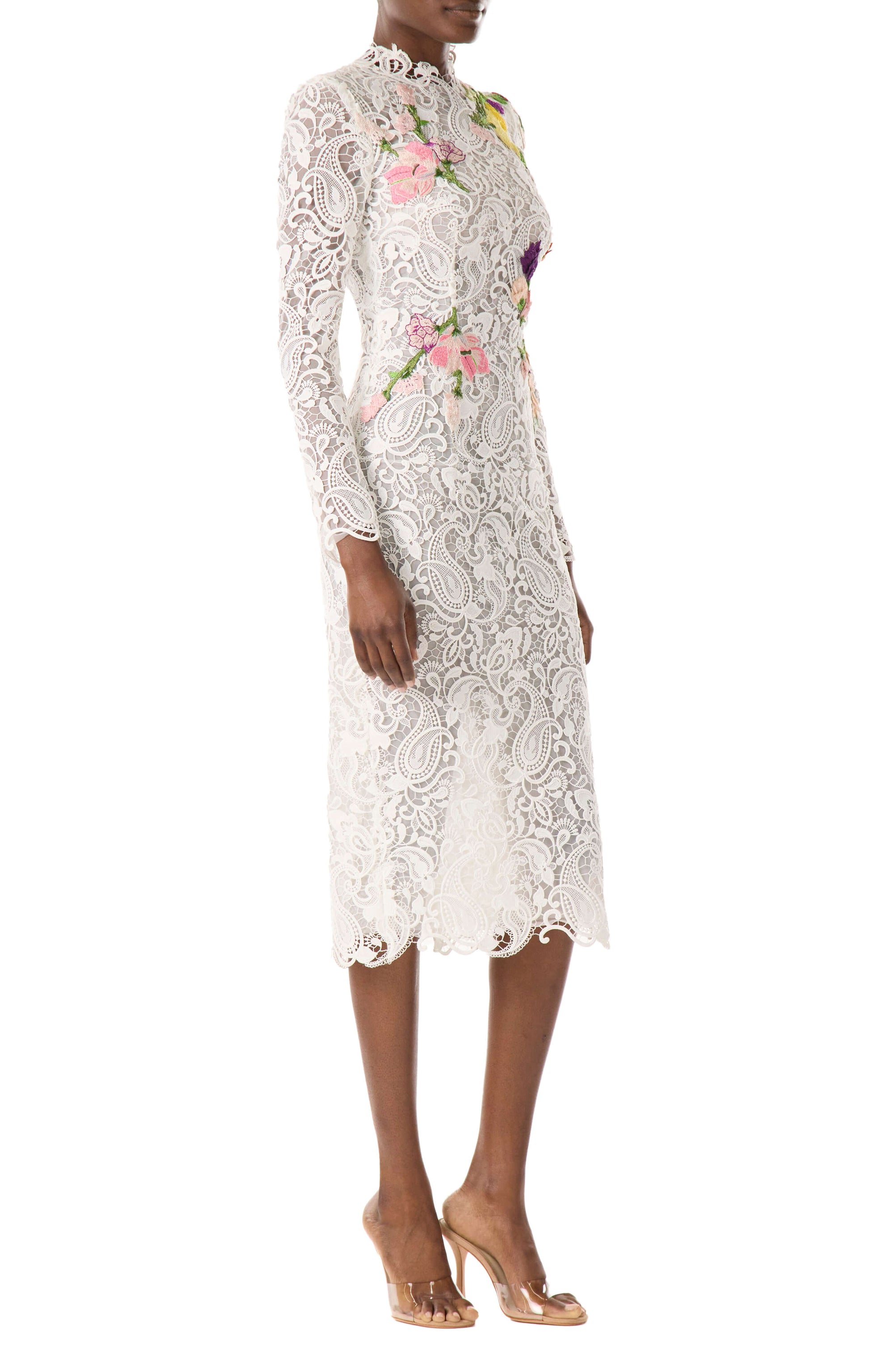 Monique Lhuillier midi length, long sleeve white lace dress with floral embroidery.