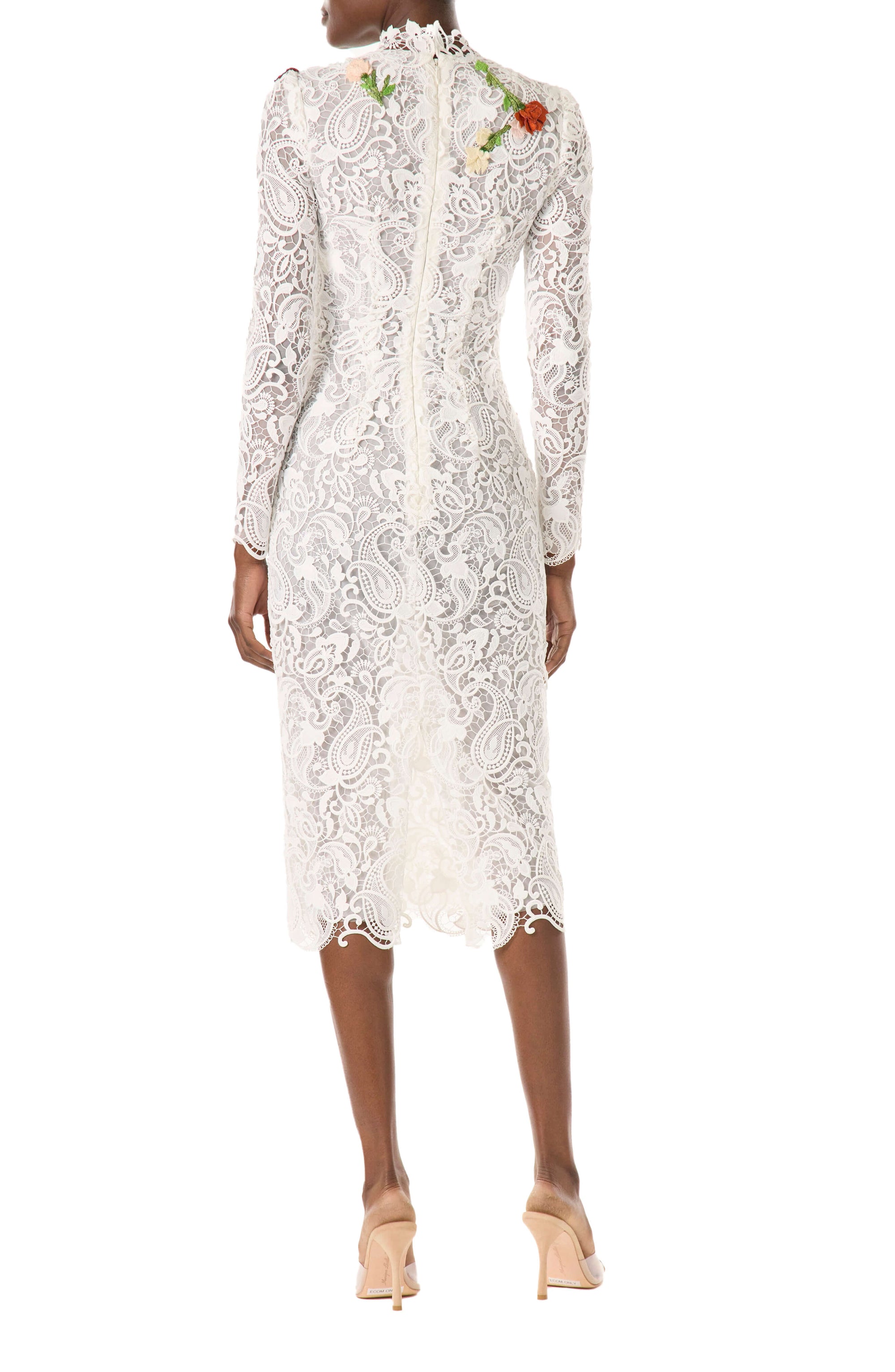 Monique Lhuillier midi length, long sleeve white lace dress with floral embroidery.
