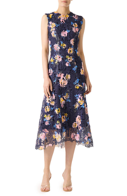 Monique Lhuillier sleeveless, midi-length dress in navy and floral printed lace.