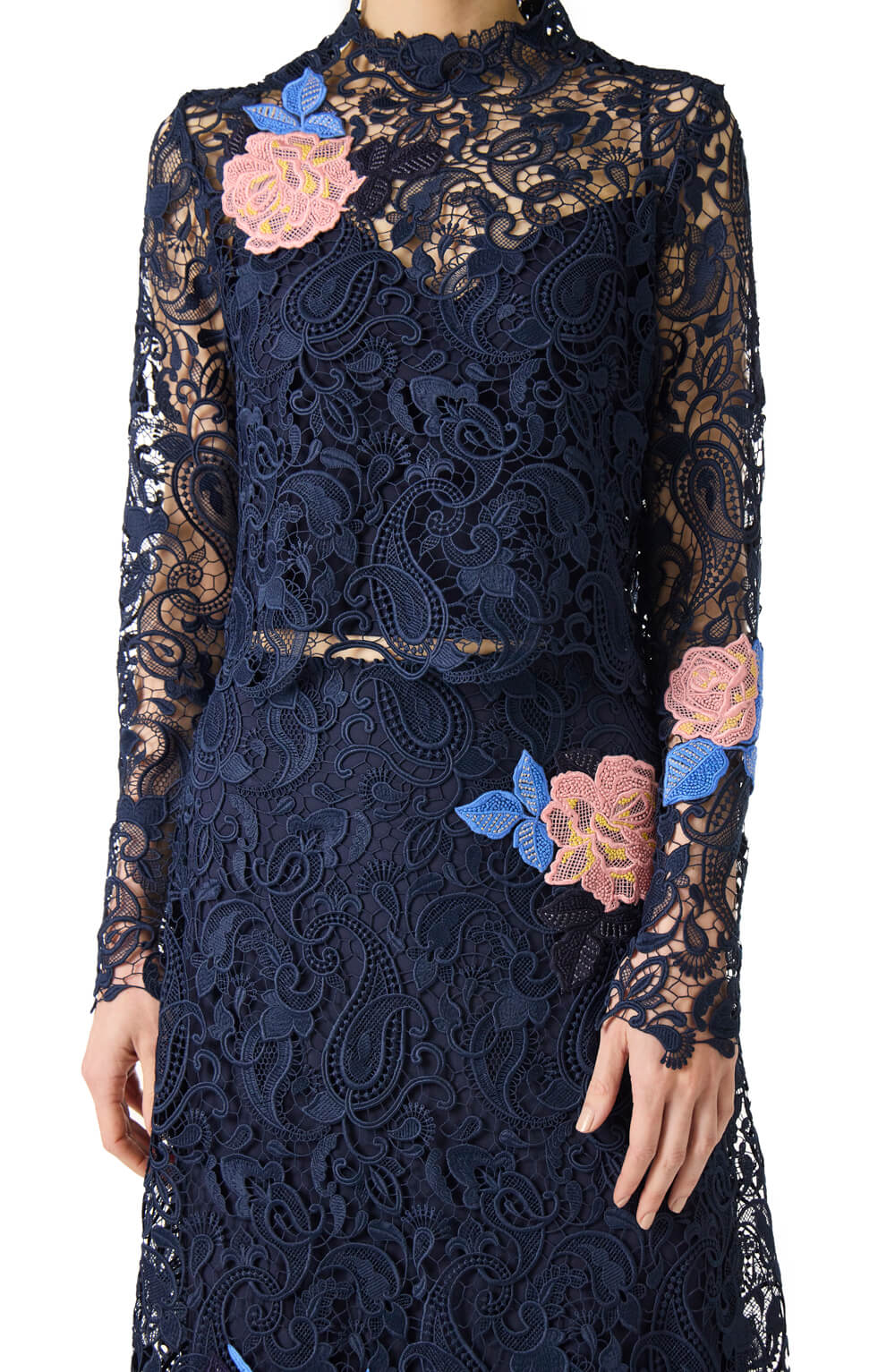 Monique Lhuillier midi-length navy guipure lace skirt with pink lace flowers.