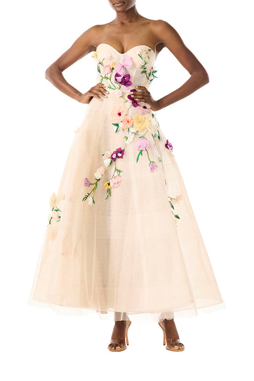 Monique Lhuillier pale blush colored strapless tulle cocktail dress with floral embroidery.
