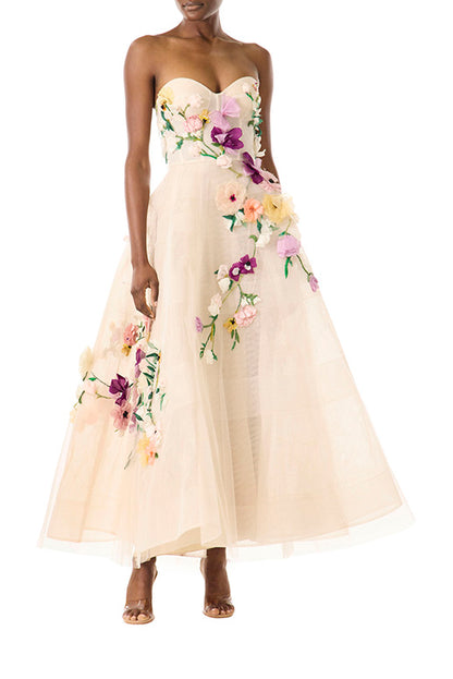 Monique Lhuillier pale blush colored strapless tulle cocktail dress with floral embroidery.