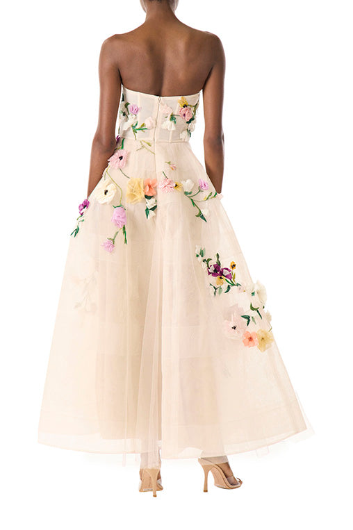Monique Lhuillier pale blush colored strapless tulle cocktail dress with floral embroidery.