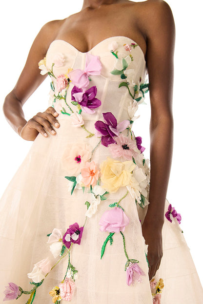 Monique Lhuillier pale blush colored strapless tulle cocktail dress with floral embroidery.